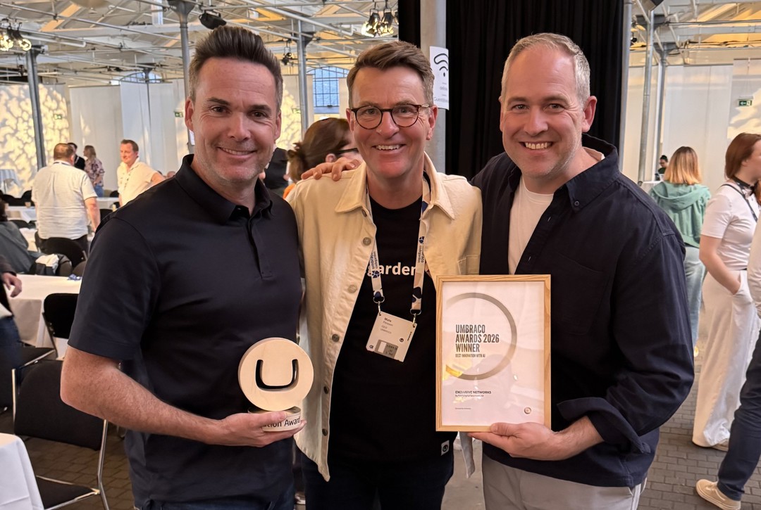 Celebrating the win with Umbraco CEO Mats Persson (centre) — Scott Agass (left) and Peter Hinchliffe (right) with the Best Innovation with AI certificate.